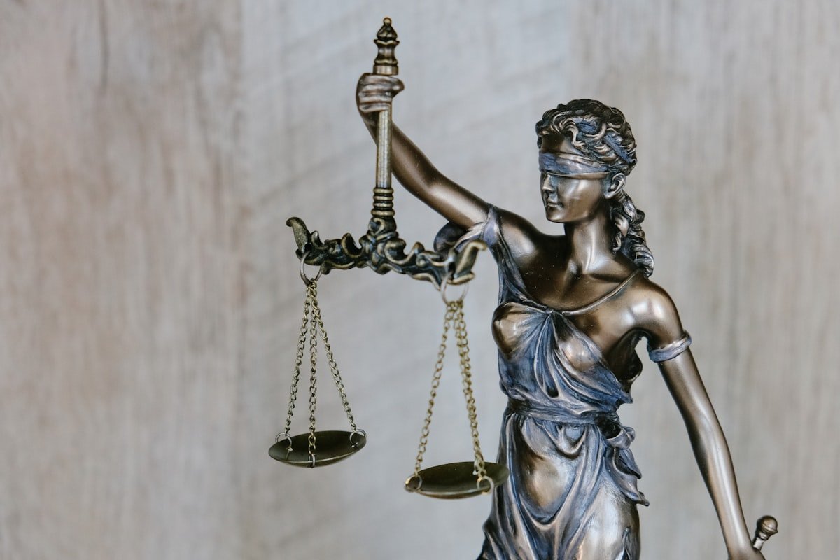 Bronze statue of Lady Justice holding the scales